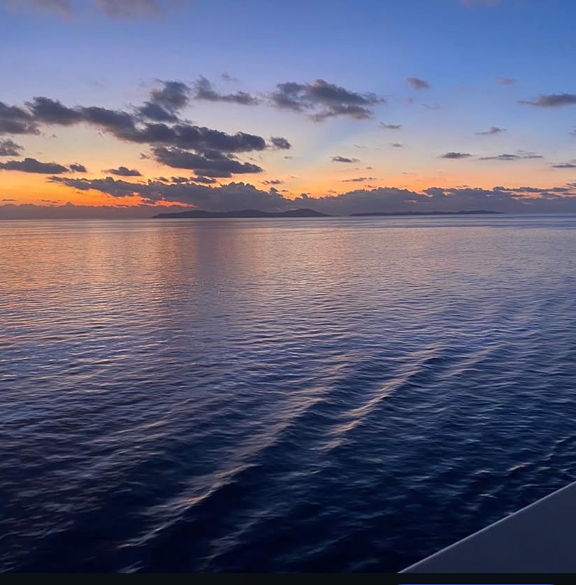 Calm sea at sunset representing reflection and what comes next – Marlon Amele